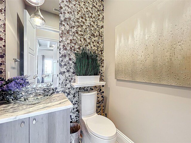 16246 Ravenna Ct, Montverde, FL 34756 - half bath with vanity, toilet, and baseboards