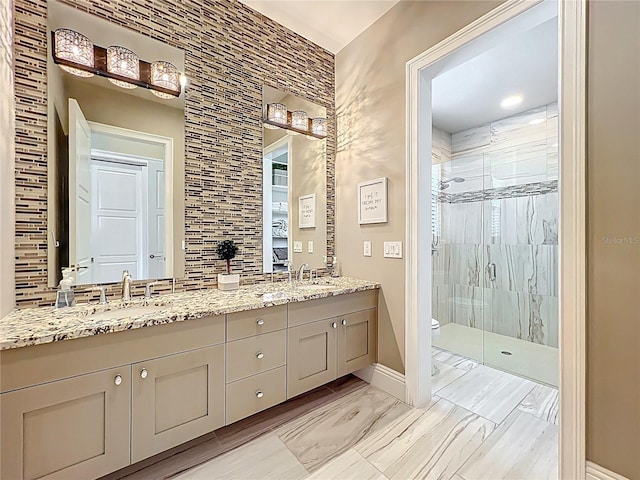 16246 Ravenna Ct, Montverde, FL 34756 - full bathroom with a stall shower, toilet, double vanity, baseboards, and marble finish flooring