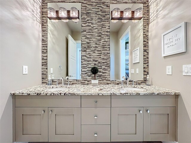 16246 Ravenna Ct, Montverde, FL 34756 - bathroom with double vanity and backsplash