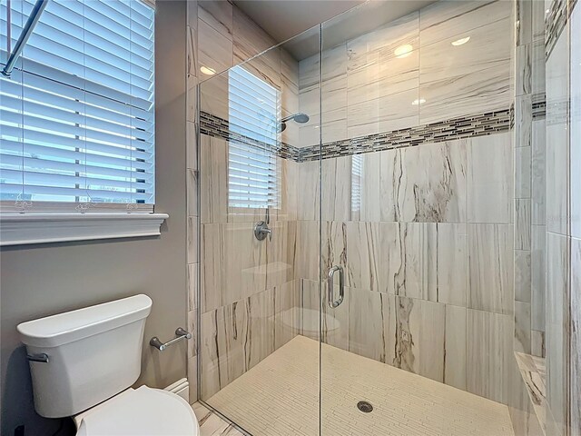 16246 Ravenna Ct, Montverde, FL 34756 - full bath featuring toilet, a stall shower, and healthy amount of natural light