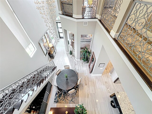 16246 Ravenna Ct, Montverde, FL 34756 - stairway featuring a towering ceiling