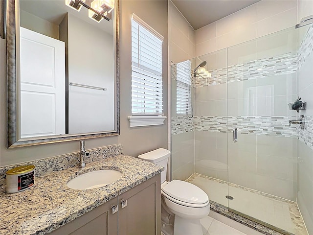 16246 Ravenna Ct, Montverde, FL 34756 - full bathroom with a shower stall, toilet, vanity, and tile patterned floors