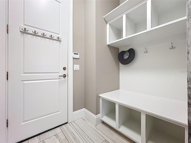 16246 Ravenna Ct, Montverde, FL 34756 - mudroom featuring baseboards