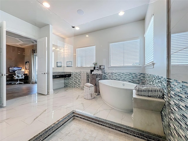 16246 Ravenna Ct, Montverde, FL 34756 - full bathroom featuring a freestanding tub, marble tiled flooring, and recessed lighting