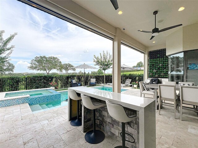 16246 Ravenna Ct, Montverde, FL 34756 - fenced backyard with a patio area, a ceiling fan, and a pool with connected hot tub