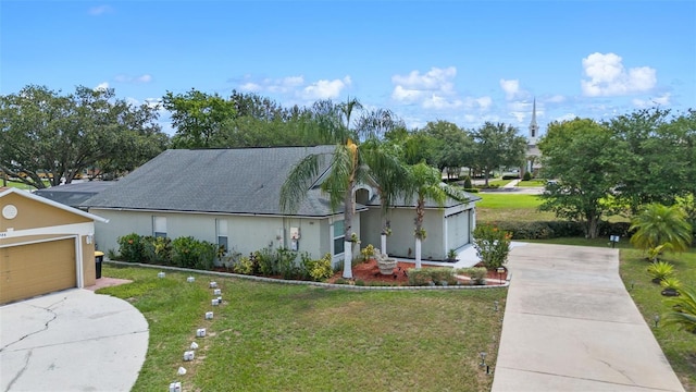 404 Obo Dr, Davenport, FL 33896 - view of front of home featuring driveway, a front yard, a garage, and stucco siding