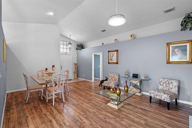 404 Obo Dr, Davenport, FL 33896 - dining space with vaulted ceiling, wood finished floors, and baseboards