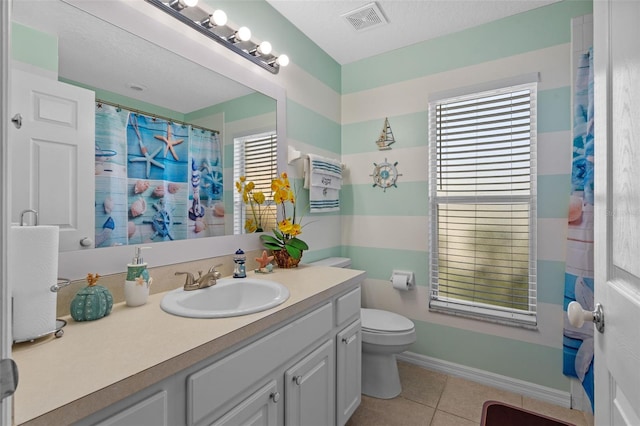 404 Obo Dr, Davenport, FL 33896 - bathroom with vanity, tile patterned flooring, and toilet