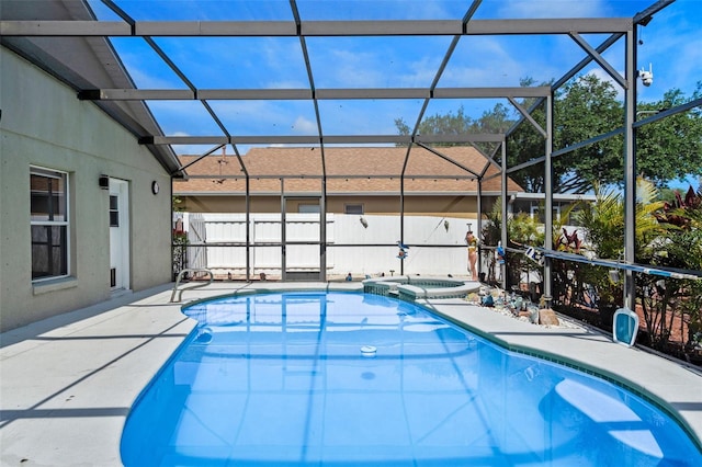 404 Obo Dr, Davenport, FL 33896 - view of swimming pool with glass enclosure, a patio, and a pool with connected hot tub