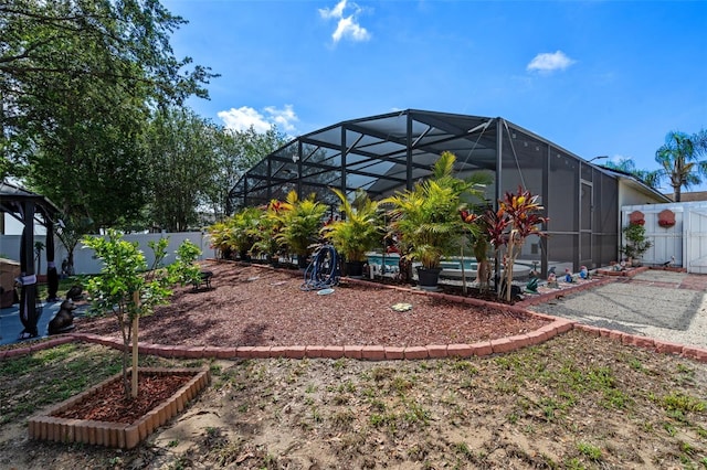 404 Obo Dr, Davenport, FL 33896 - fenced backyard featuring glass enclosure, a patio area, and a swimming pool