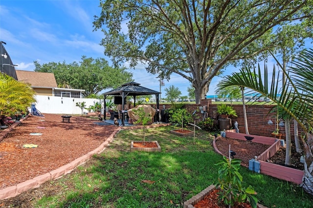 404 Obo Dr, Davenport, FL 33896 - view of yard featuring a vegetable garden and a gazebo