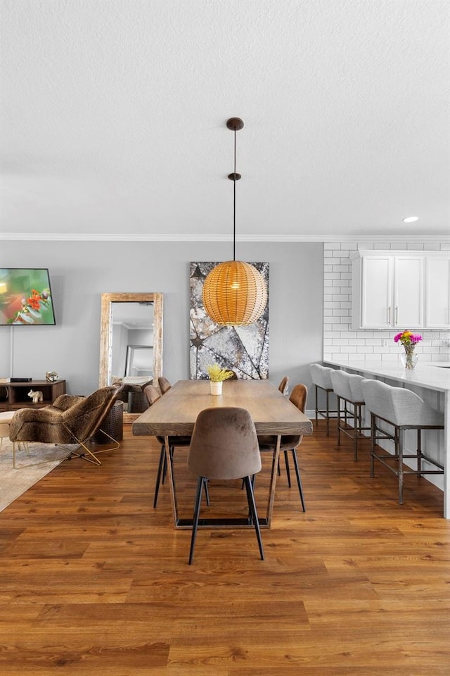 17404 Chateau Pine Way, Clermont, FL 34711 - dining space with light wood finished floors and a textured ceiling