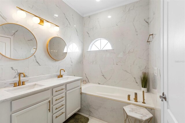 17404 Chateau Pine Way, Clermont, FL 34711 - bathroom featuring a tub with marble appearance, double vanity, tile walls, and ornamental molding