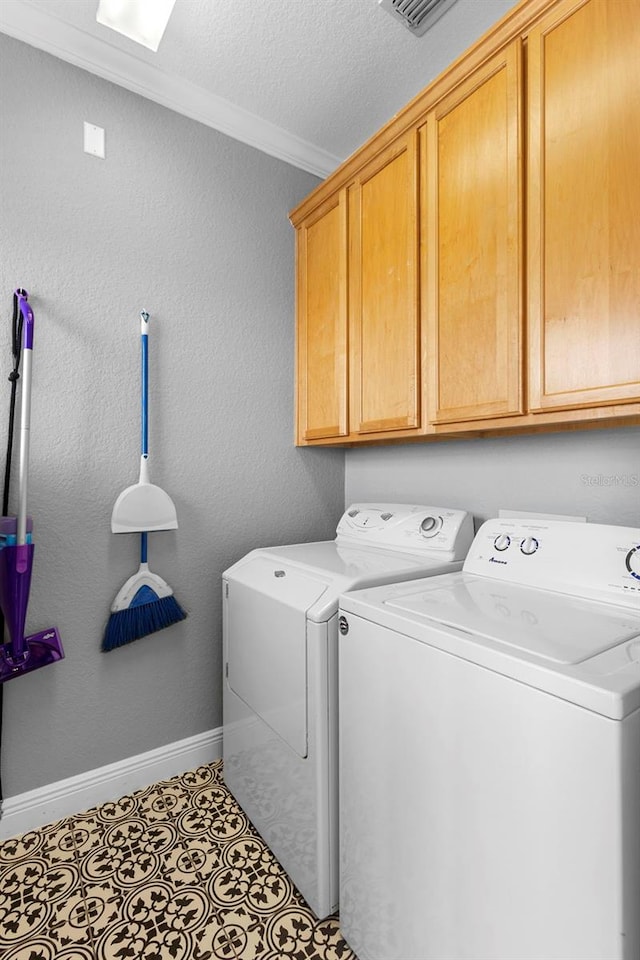 17404 Chateau Pine Way, Clermont, FL 34711 - washroom featuring cabinet space, washer and dryer, crown molding, baseboards, and a textured ceiling