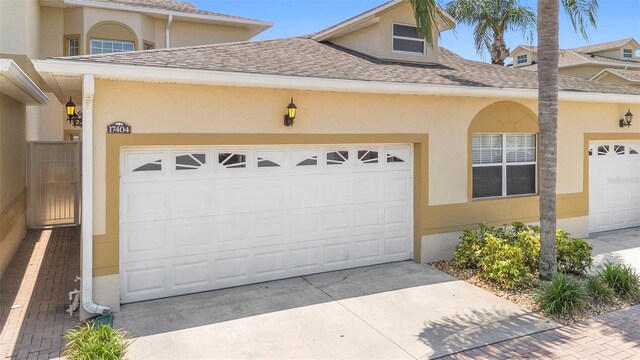 17404 Chateau Pine Way, Clermont, FL 34711 - garage with concrete driveway
