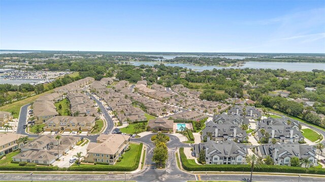 17404 Chateau Pine Way, Clermont, FL 34711 - aerial perspective of suburban area with a nearby body of water