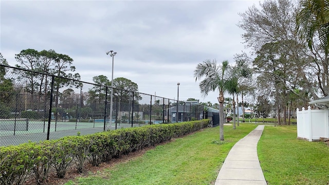 view of property's community featuring a tennis court