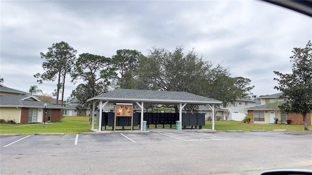 uncovered parking lot featuring mail area