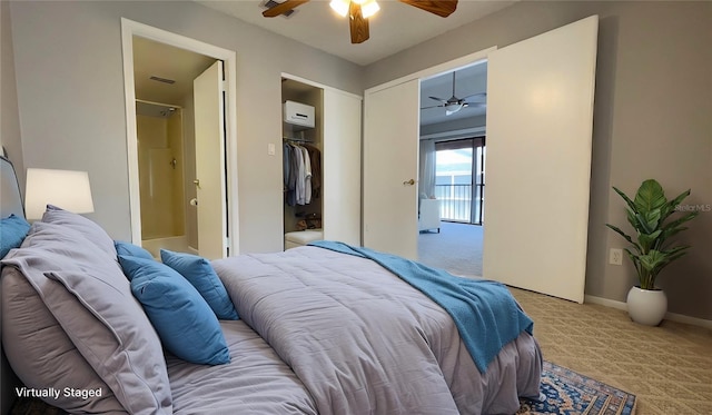 bedroom featuring light carpet, ensuite bathroom, a closet, baseboards, and ceiling fan