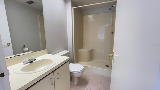 full bathroom featuring toilet, tile patterned floors, vanity, and a shower
