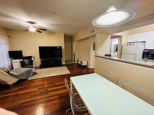 living room with dark wood-type flooring, ceiling fan, and an office area