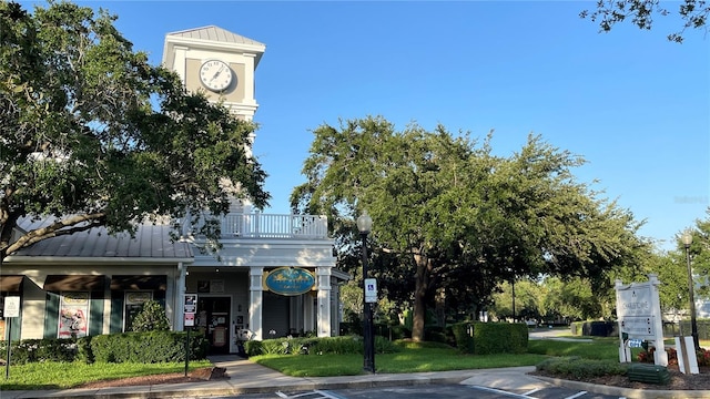 view of property with uncovered parking