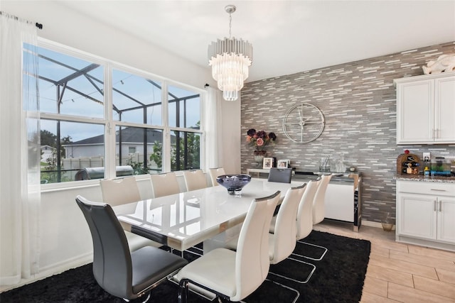 2215 Upland Ln, Apopka, FL 32712 - dining space with a chandelier and light wood-style floors