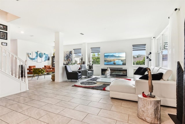 2215 Upland Ln, Apopka, FL 32712 - living area featuring light tile patterned floors, stairway, and recessed lighting