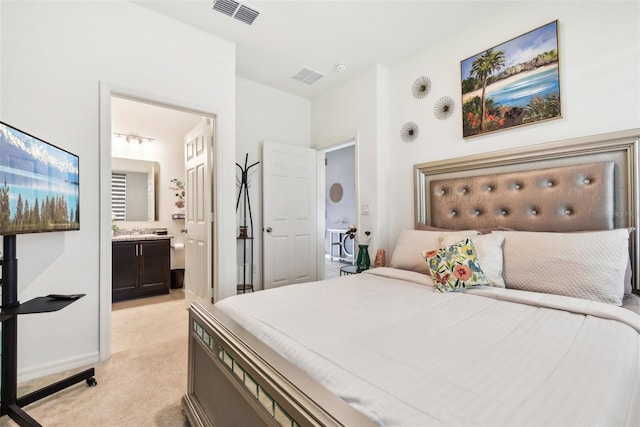 2215 Upland Ln, Apopka, FL 32712 - bedroom with light carpet and ensuite bath