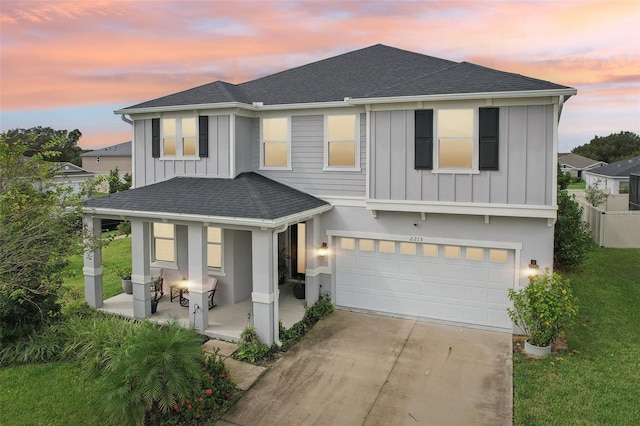 2215 Upland Ln, Apopka, FL 32712 - view of front of house with board and batten siding, a porch, roof with shingles, and concrete driveway