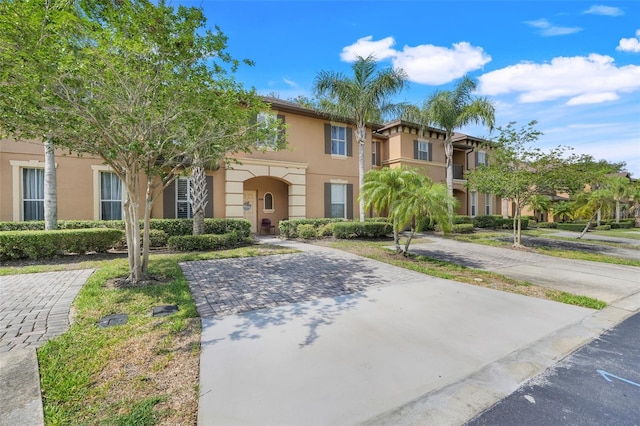 3938 Calabria Ave, Davenport, FL 33897 - view of front facade featuring stucco siding