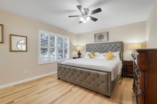 3938 Calabria Ave, Davenport, FL 33897 - bedroom with light wood-style floors, baseboards, and a ceiling fan
