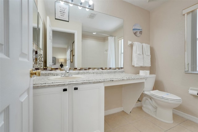3938 Calabria Ave, Davenport, FL 33897 - full bathroom with toilet, tile patterned flooring, vanity, baseboards, and curtained shower