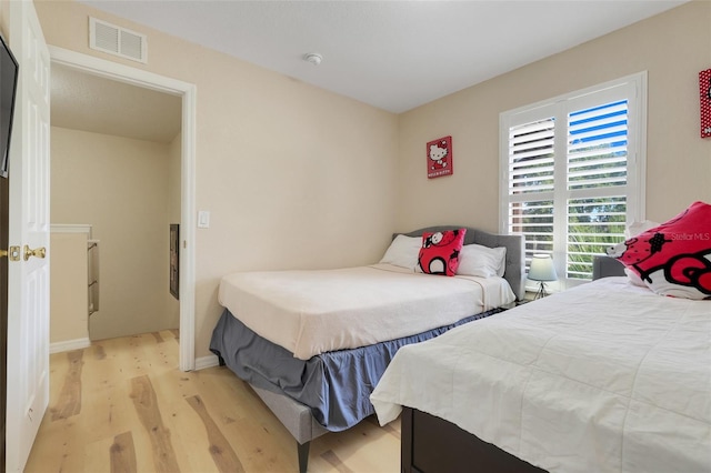 3938 Calabria Ave, Davenport, FL 33897 - bedroom featuring light wood-type flooring