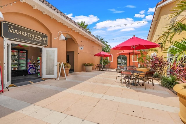 3938 Calabria Ave, Davenport, FL 33897 - view of patio / terrace with outdoor dining space