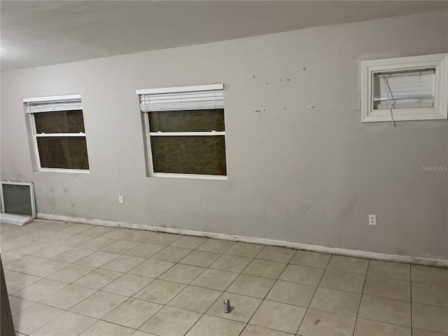 6113 Hialeah St, Orlando, FL 32808 - empty room with baseboards and light tile patterned floors
