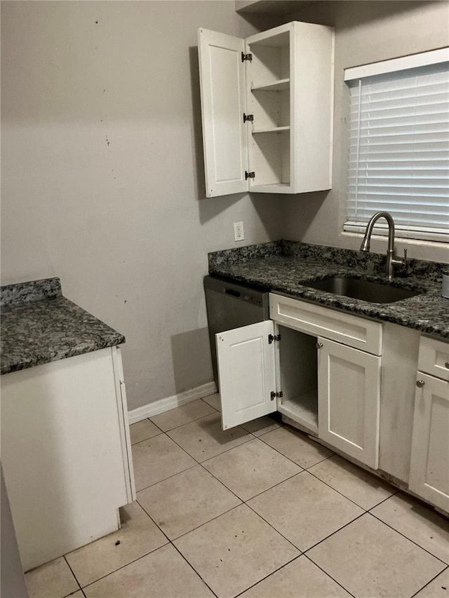 6113 Hialeah St, Orlando, FL 32808 - kitchen with a sink, open shelves, white cabinetry, and dark stone counters