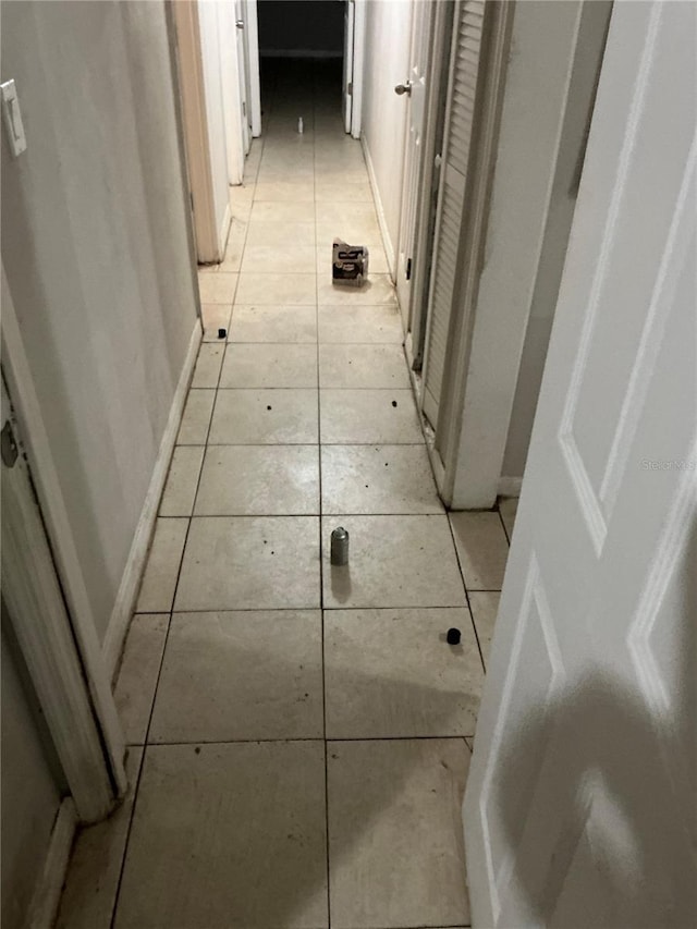 6113 Hialeah St, Orlando, FL 32808 - hall with light tile patterned floors and baseboards