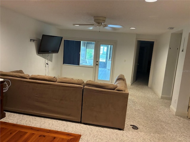 116 Oakmont Ln, New Smyrna Beach, FL 32168 - carpeted living room with a ceiling fan and baseboards