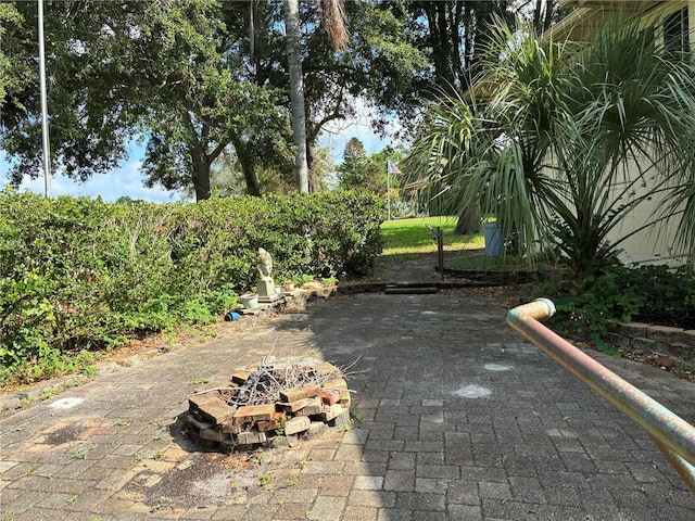 116 Oakmont Ln, New Smyrna Beach, FL 32168 - view of patio / terrace with an outdoor fire pit