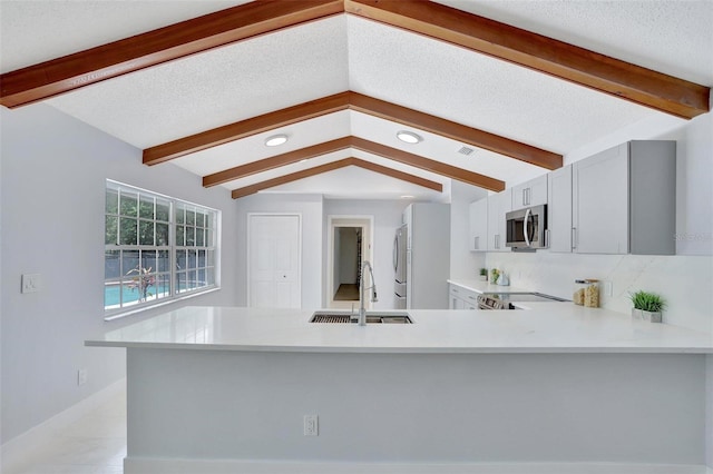 140 Sweet Bay Cir, Lake Mary, FL 32746 - kitchen featuring a sink, stainless steel appliances, light countertops, recessed lighting, and a peninsula
