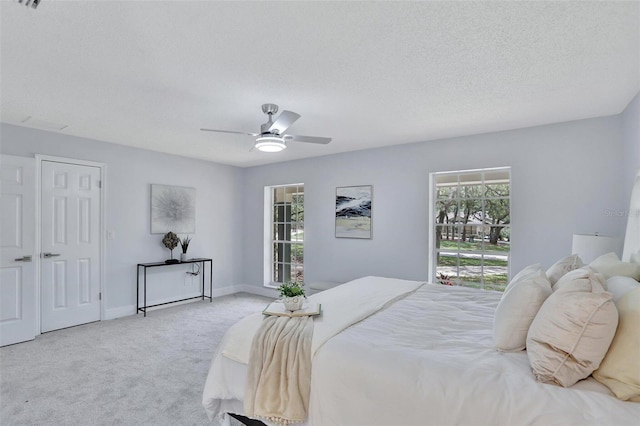 140 Sweet Bay Cir, Lake Mary, FL 32746 - carpeted bedroom featuring a textured ceiling, ceiling fan, and baseboards