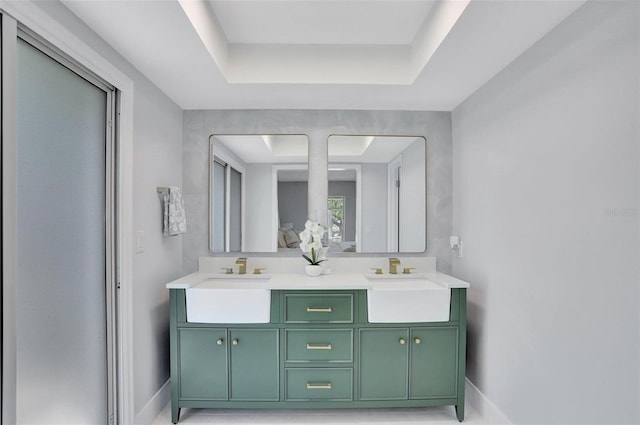 140 Sweet Bay Cir, Lake Mary, FL 32746 - bathroom with baseboards, double vanity, and a raised ceiling