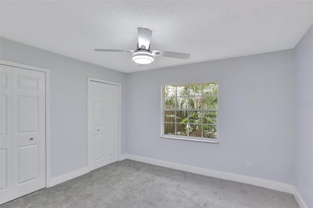 140 Sweet Bay Cir, Lake Mary, FL 32746 - unfurnished bedroom featuring carpet floors, baseboards, ceiling fan, and a textured ceiling