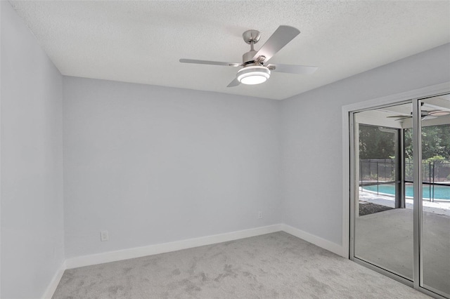 140 Sweet Bay Cir, Lake Mary, FL 32746 - spare room with carpet, a ceiling fan, a textured ceiling, and baseboards