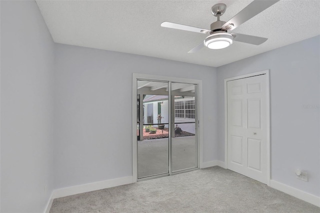 140 Sweet Bay Cir, Lake Mary, FL 32746 - unfurnished bedroom featuring light carpet, baseboards, a textured ceiling, and a ceiling fan