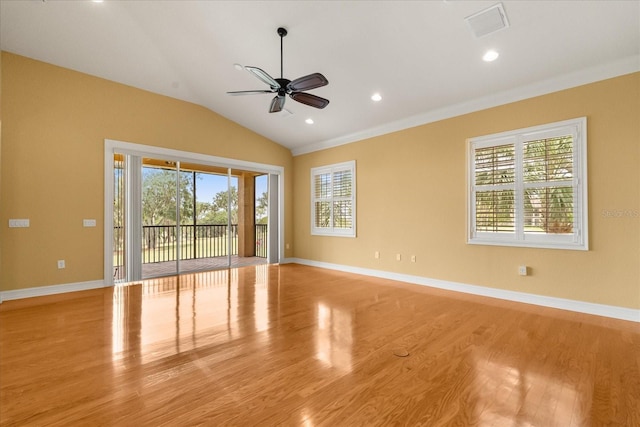14 Camino Real Blvd Unit 14, Howey In The Hills, FL 34737 - unfurnished room featuring light wood-type flooring, a ceiling fan, vaulted ceiling, and baseboards