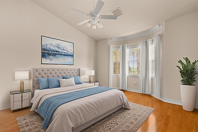 14 Camino Real Blvd Unit 14, Howey In The Hills, FL 34737 - bedroom featuring light wood-style flooring, baseboards, lofted ceiling, and a ceiling fan