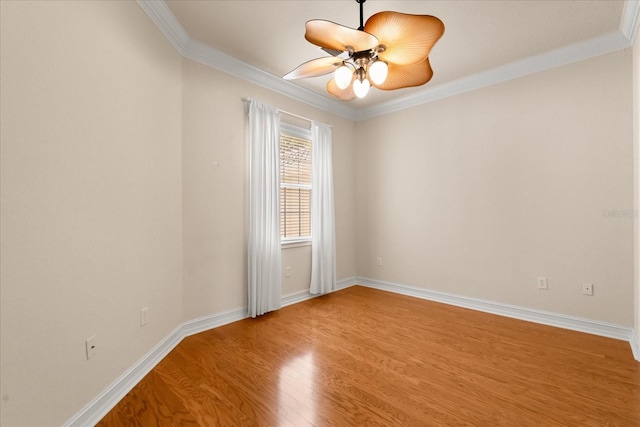 14 Camino Real Blvd Unit 14, Howey In The Hills, FL 34737 - unfurnished room with ornamental molding, wood finished floors, baseboards, and a ceiling fan