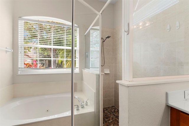 2359 Baronsmede Ct, Winter Garden, FL 34787 - bathroom with tiled shower, a whirlpool tub, and vanity